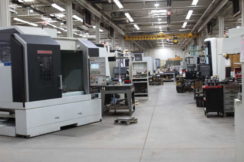 CNC lathe machining an aluminum part to micron tolerances