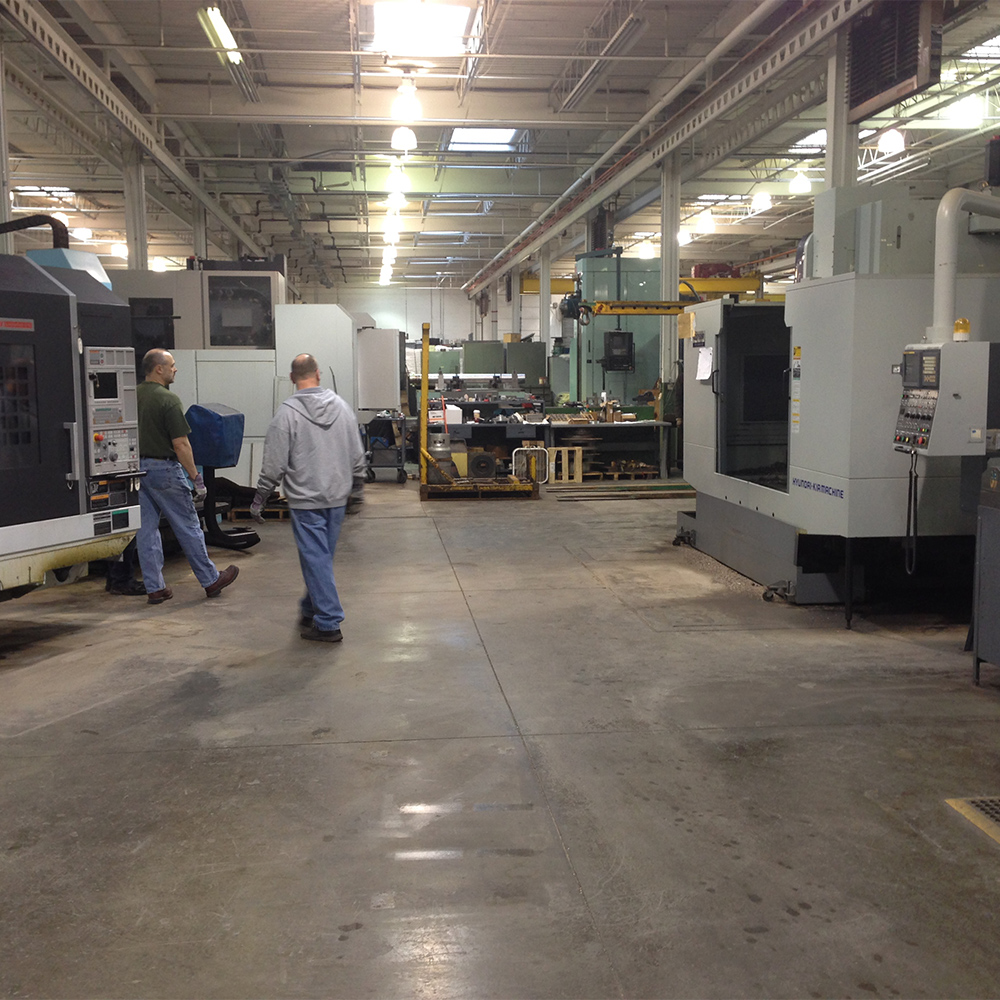 CNC machine shop floor with vertical machining centers at FM Machine