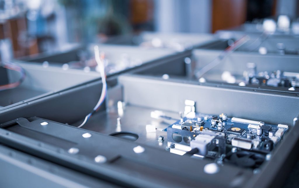 electronic components on metal frame in light - Electronics Precision Machining Services Electronics Precision Machining Services - electronic components on metal frame in light