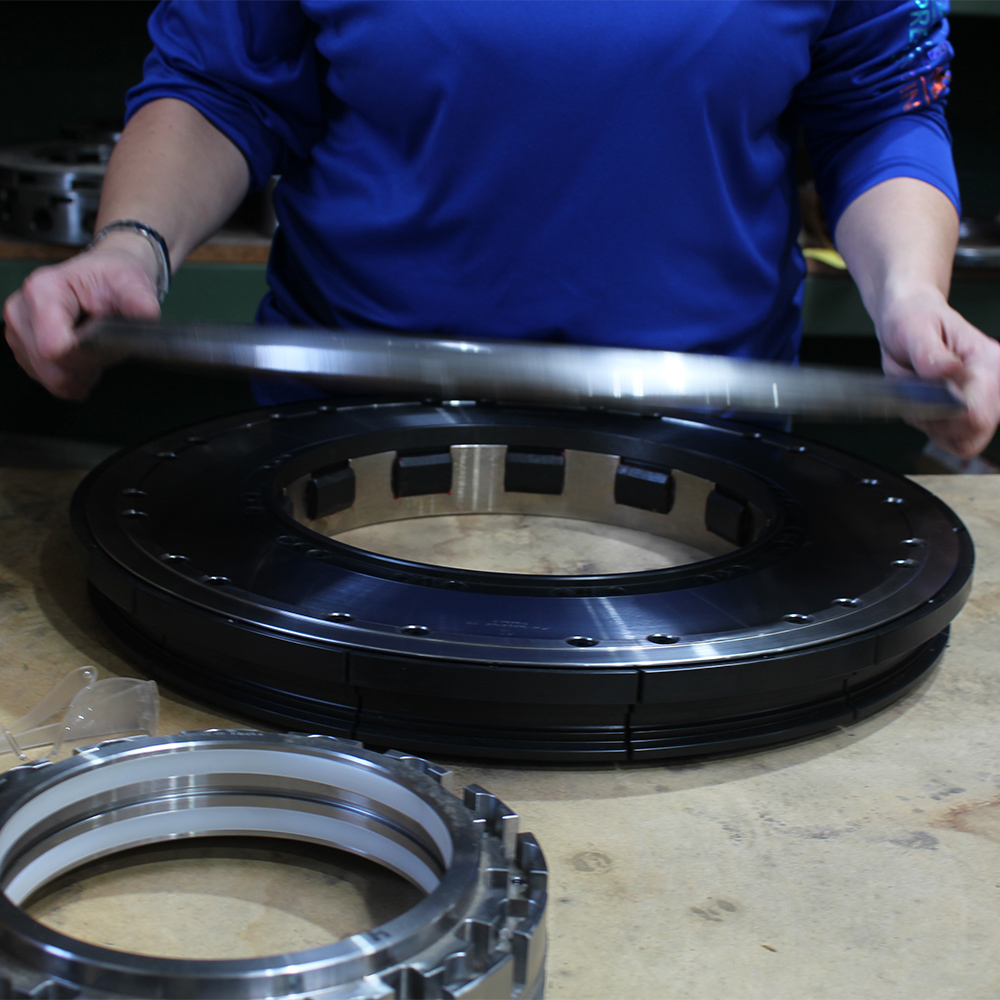 Large machined ring assembly being hand-assembled at FM Machine